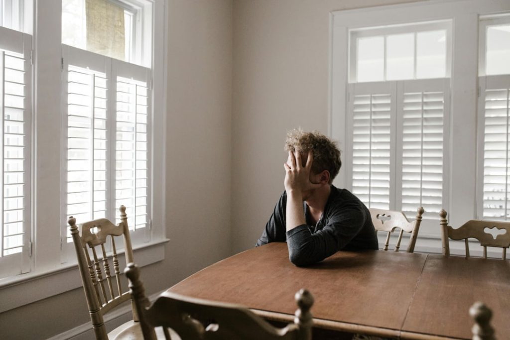 a man looking out of his window
